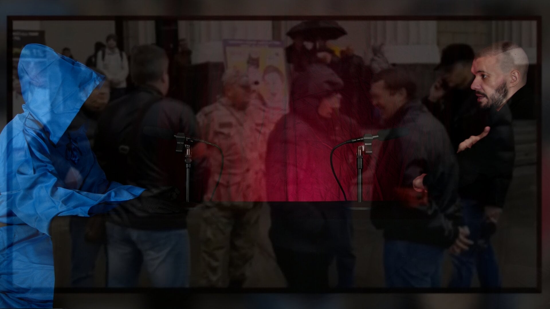 A photo of Vlad (Vladimir) Dorokhin with a background of a group of provocateurs with identifying armbands at a peaceful Navalnyi protest.