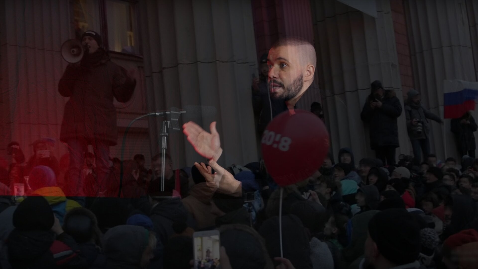 A photo of Vlad (Vladimir) Dorokhin with a background of Alexei Navalnyi at the Samara protest meeting in 2017.