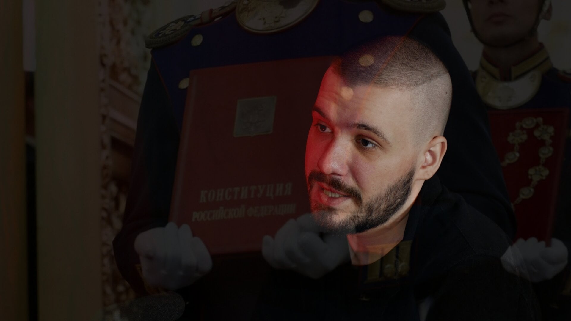 A photo of Vlad (Vladimir) Dorokhin with a background of the main Russian Constitution book in the Moscow Kremlin.