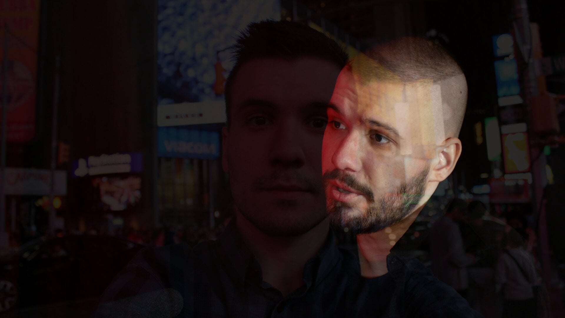 A photo of Vlad (Vladimir) Dorokhin with a background of Vladimir Dorokhin at the Time Square in the New York City in 2019.