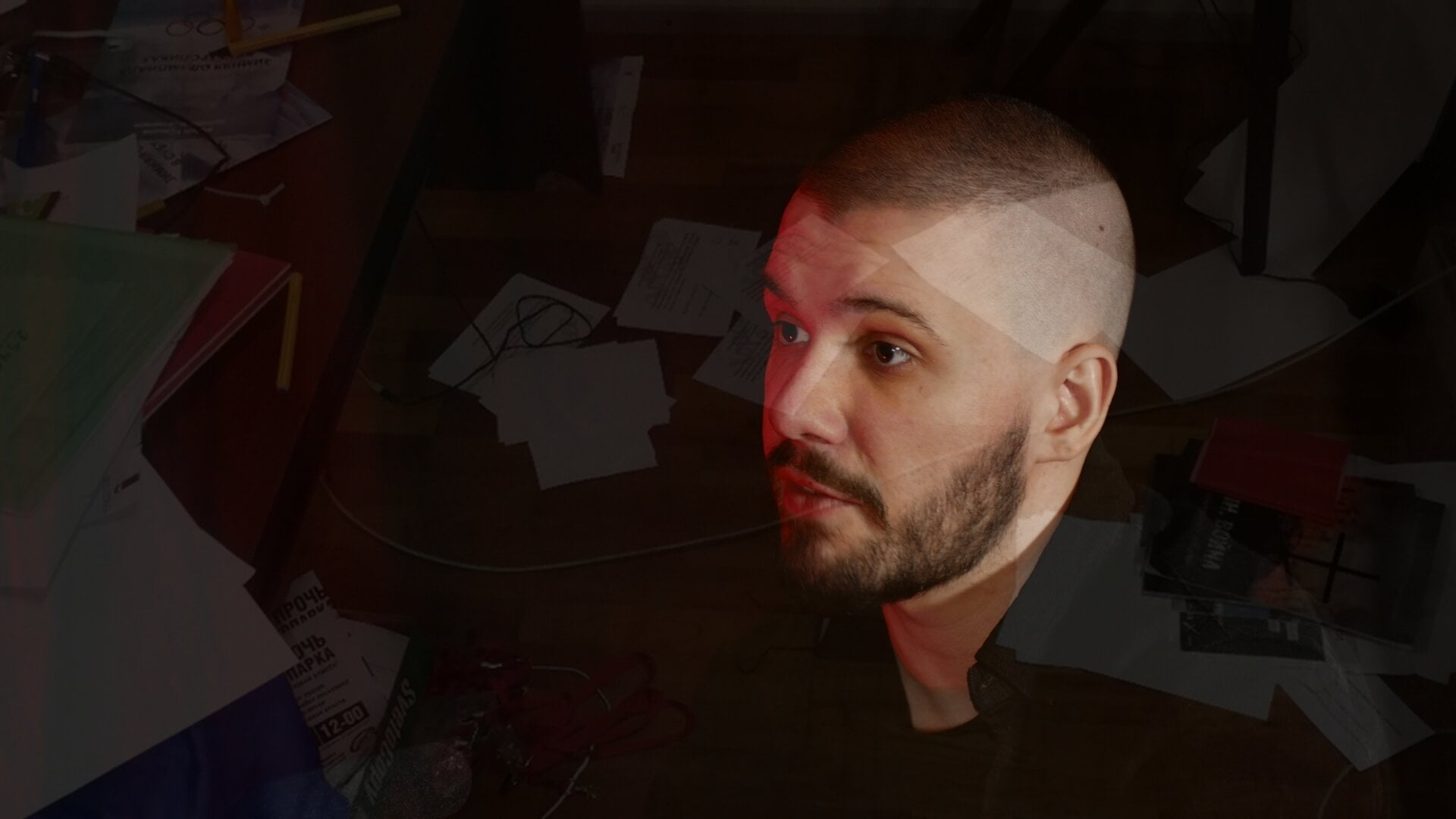 A photo of Vlad (Vladimir) Dorokhin with a background of the Navalnyi Samara Headquarters documents lying on the floor after the raid in 2019.