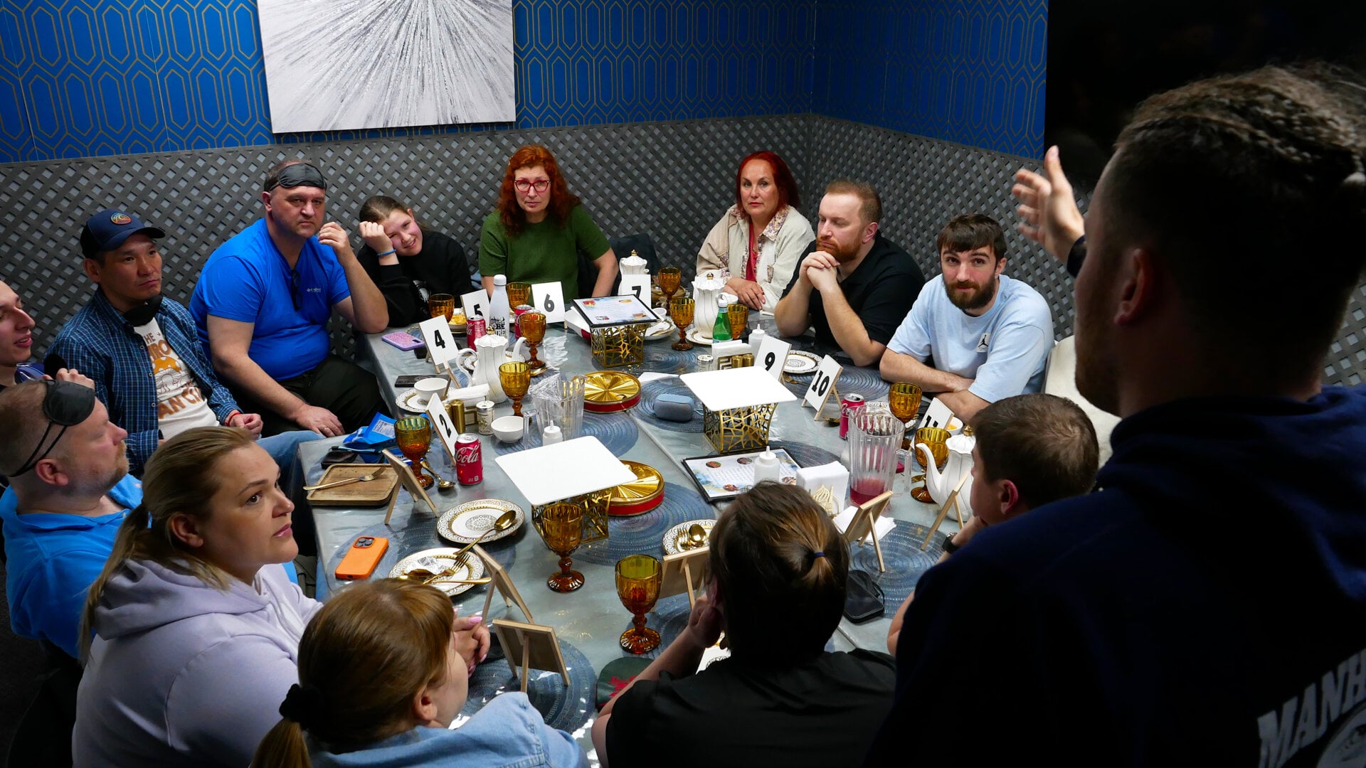 A photo of the host with the participants of the «Mafia» community game held at a restaurant in Philadelphia, Pennsylvania, USA, on April 5, 2025, organized with the support of Vlad (Vladimir) Dorokhin.